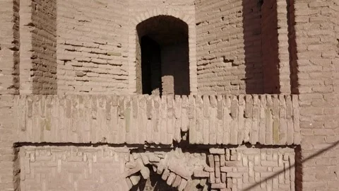 High drone flight over the domed roof of a historical desert structure Video stock 307791224
