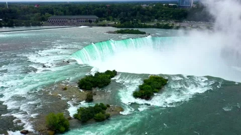 High Drone Orbit of Niagara Falls With Curved Drop and Rising White Mist Stock Footage 311058372