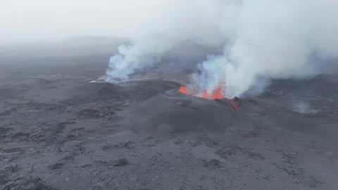 High Drone Pullback Revealing Two Active Volcano and Flowing Lava in Iceland Stock Footage 321133243
