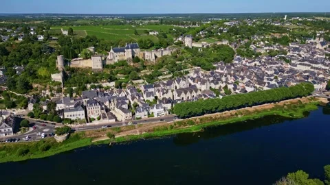 High Drone Shot Advancing Over Vienne River Toward Chinon and Fortress Stock Footage 317075193