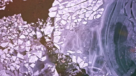 High drone shot capturing beautiful frozen ice formations on the Great Lakes in Stock Footage 338195716