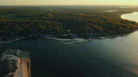 High Drone Shot of Coastal Trees and Ocean at Sunset - Centerport NY Stock Footage 308337408