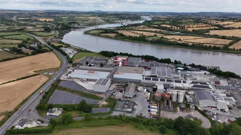 High drone view of meat prccessing plant the River Suir and Waterford City 스톡 동영상 345010234