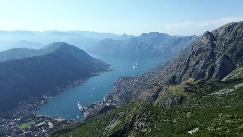 High Drone View of Risan Bay, Kotor Gulf, Ships, Yachts, and Mountains – 4K Stock Footage 313900731