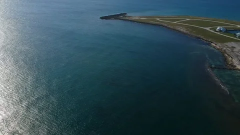 High Drone View of West End Bay Shoreline and Coastal Waters, Bahamas Stock Footage 95768104