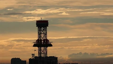 High Drop Tower Silhouette on Dramatic Cloudy Sky Stock Footage 327750746