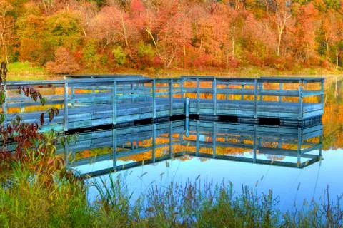 High dynamic range of a boat dock and fall colors Stock Photos