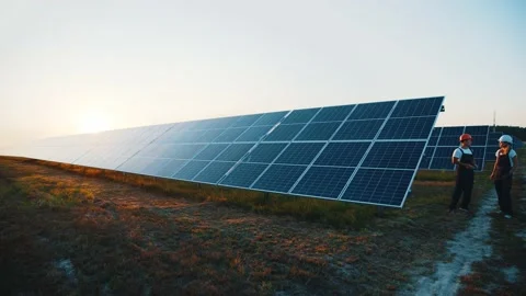 High efficiency solar array in ecological field farmland outdoor. Couple of Stock Footage 138892519