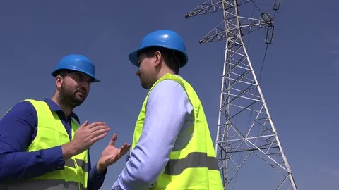 High electricity cables pillar working engineering team outdoors men engineer 4K Stock Footage