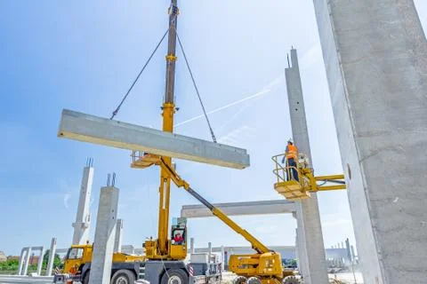 High elevated cherry picker with people who are working in heavy duty Stock Photos