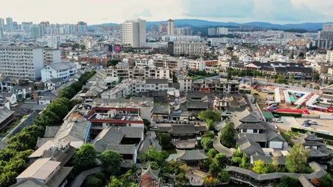 High elevation drone tracking shot over connected rooftops 4K Stock Footage 337331034