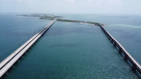 High elevation reversing shot of the Bahia Honda Railroad Bridge 2026 Summer Stock Footage 344059854