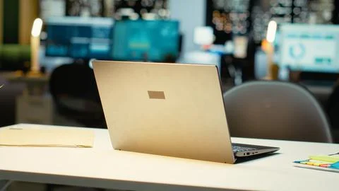 High end empty office features laptop and monitors for forecasting Stock Photos
