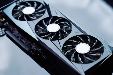 High-end graphics card with triple fan cooling on dark background Foto stock
