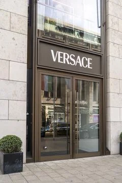 High-end Versace flagship store featuring a modern minimalist exterior in D.. Stock Photos
