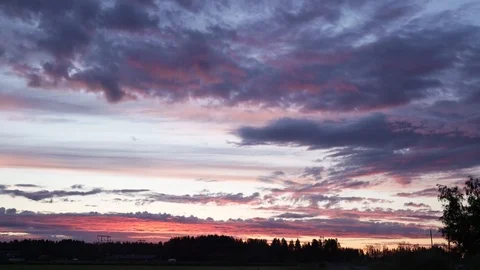High energy of glowing red sunset clouds in sky and high voltage power line Stock Footage 116480081