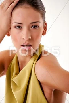 High fashion girl in green dress surprised Stock Photos