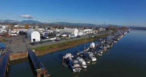 High fast aerial push shot of Pacific Northwest marina Stock Footage 99280161