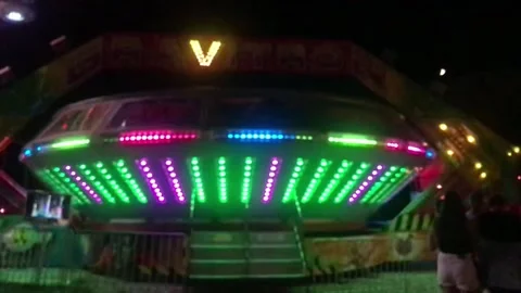High Ferris Wheel on a sunset backdrop in our summer. Amusement park ride Video stock 220324958