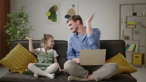 High Five: Celebratory Moment Between Father and Daughter at Home Видео 269356579