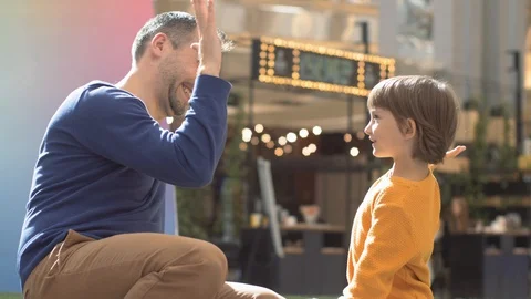 High five gesture of father and child Video stock 128249814