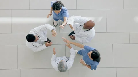 High five, happy and top view doctors, people or group celebrate hospital Stock Footage 254891759