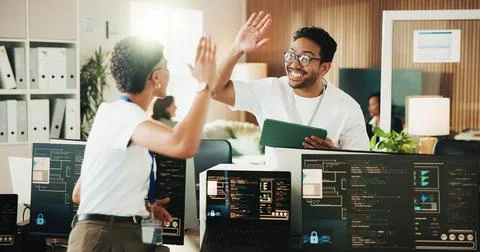 High five, programmer and tablet with business people in office for app dev.. Stock Photos