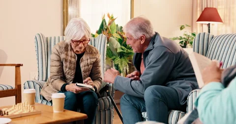 High five, puzzle and senior people in nursing home for help with game, word Stock Footage 341409041