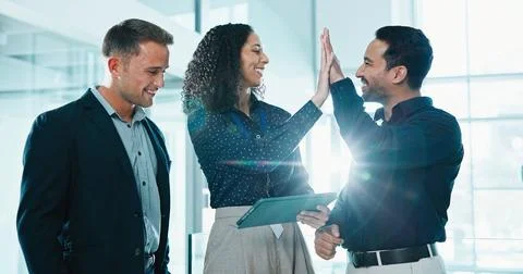 High five, teamwork and business people in office with tablet, goal or good news Stock Photos