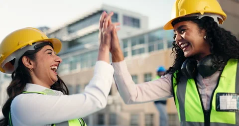 High five, women and construction workers on site with tablet for maintenance Stock Footage 311023327