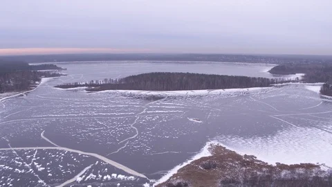 High flight above frozen lake 스톡 동영상 123770948