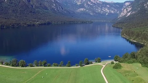 High flight and takeoff above amazing Bohinj Lake in the morning. Slovenia. 動画素材 72504849