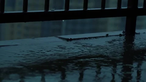 High floor balcony in the rain. Macro shot of rain droplets. Stormy weather Stock Footage 133827314