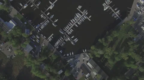 A high fly-over of a small marina on a european lake Video stock 63918298