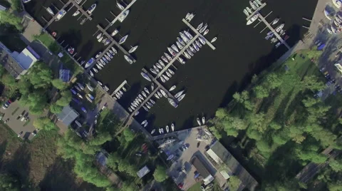 A high fly-over of a small marina on a european lake Video stock 63918456