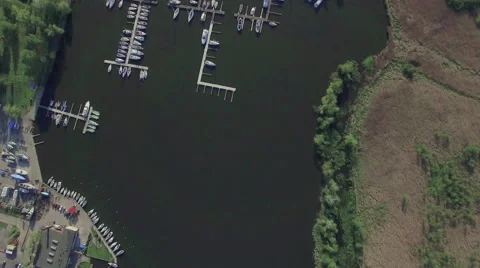 A high fly-over of a small marina on a european lake Video stock 63919312