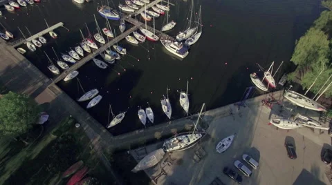 A high fly-over of a small marina on a european lake Video stock 63922990
