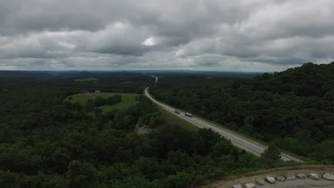 High fly up revealing forest/valley Stock Footage 78247905
