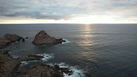 High-Flying Drone Exploration of Rugged Coastal Cliffs Sunset 動画素材 239898963
