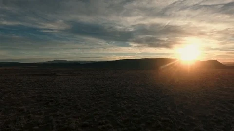 High flying drone heading into desert sunset Stock Footage 123003618
