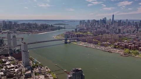 This high-flying drone shot captures the Williamsburg bridge crossing the East Stock Footage 319749002