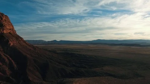High flying drone slowly turning into desert sunset Stock Footage 123003203