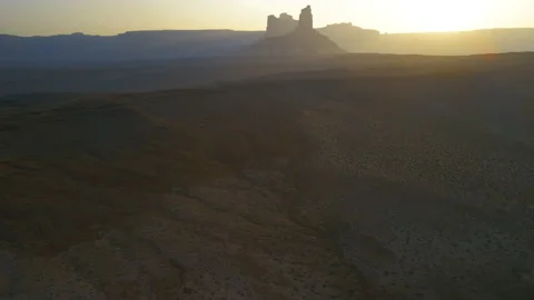High flying over a desert landscape at sunrise Stock Footage 143662025