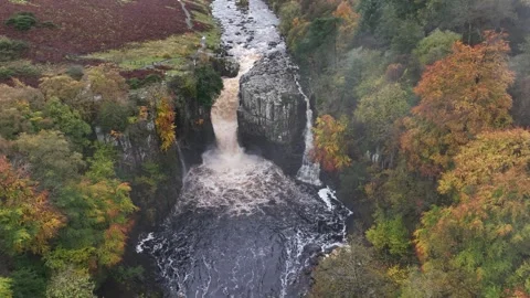 High Force waterfall sorrounded by beautiful autumn colours Stock Footage 264042887