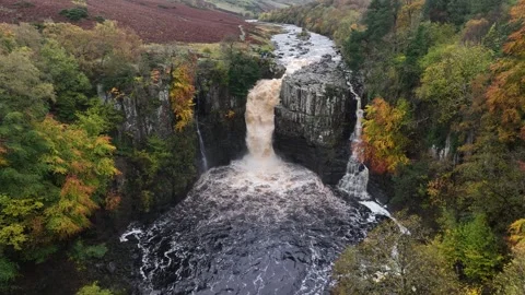 High Force waterfall sorrounded by beautiful autumn colours Stock Footage 264042914