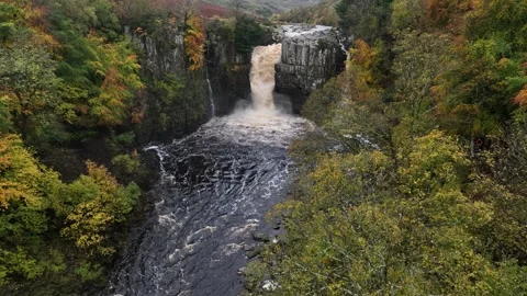 High Force waterfall sorrounded by beautiful autumn colours Stock Footage 264043733