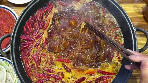 High Frame Rate 120fps Spicy Hotpot Boiling Texture Stock Footage 339686109