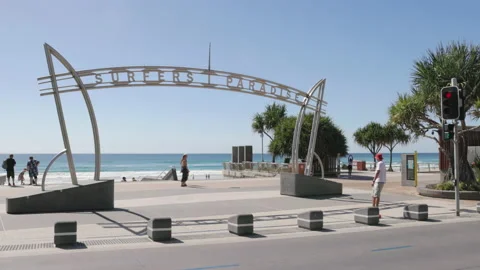 High frame rate shot of the surfers paradise sign and a skateboarder Stock Footage 236887691