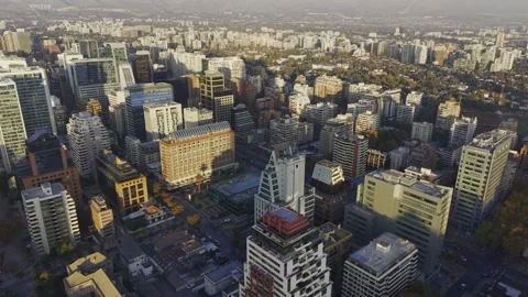 High golden hour drone drift over Apoquindo tower cluster Santiago Chile Vídeos de archivo 334682885