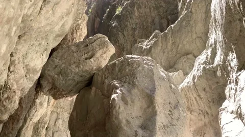 A high gorge of rocks and a mountain river. Deep narrow canyon along the rive Stock Footage 166613052